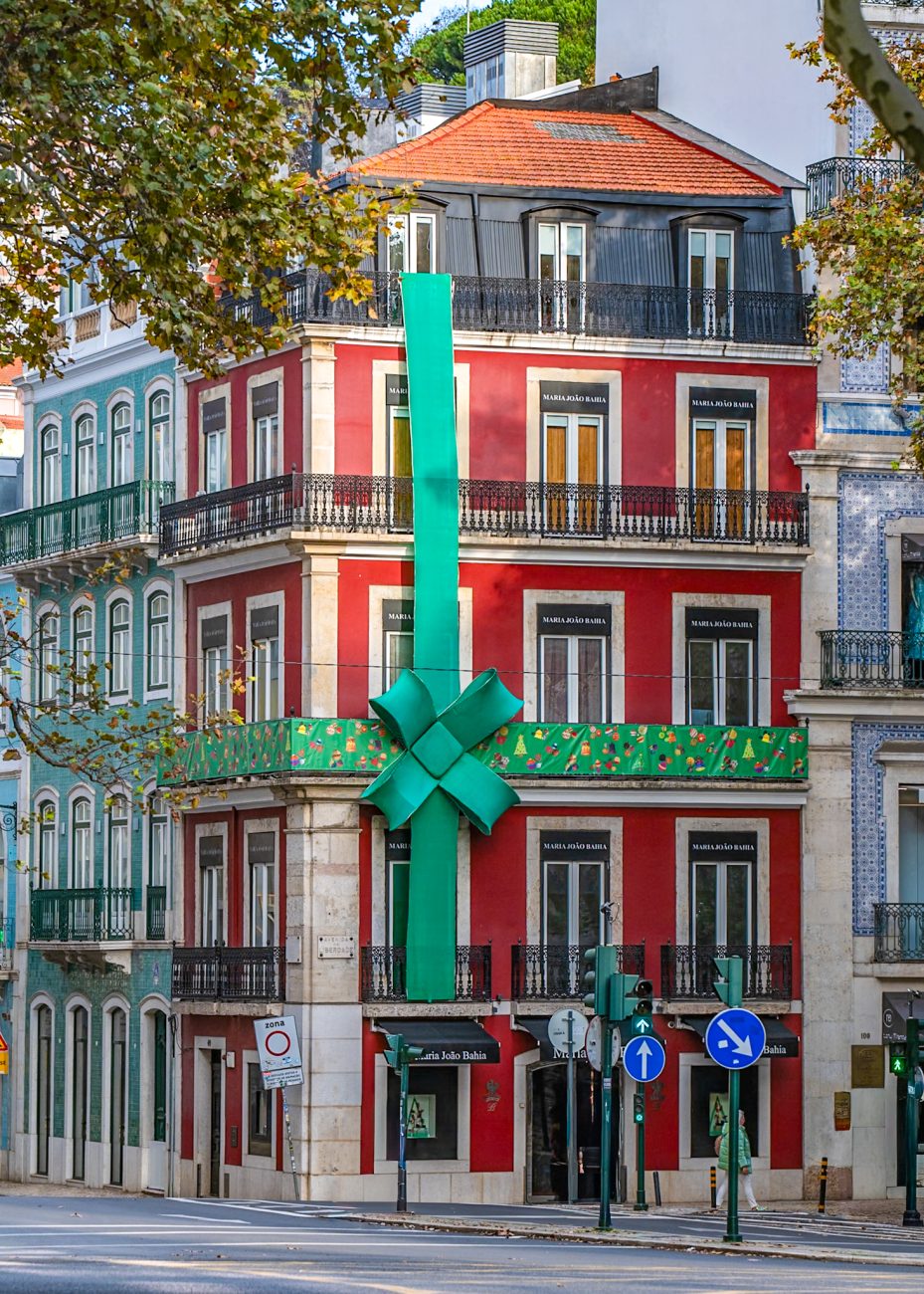 Holiday shopping in Lisbon with Christmas lights and shoppers