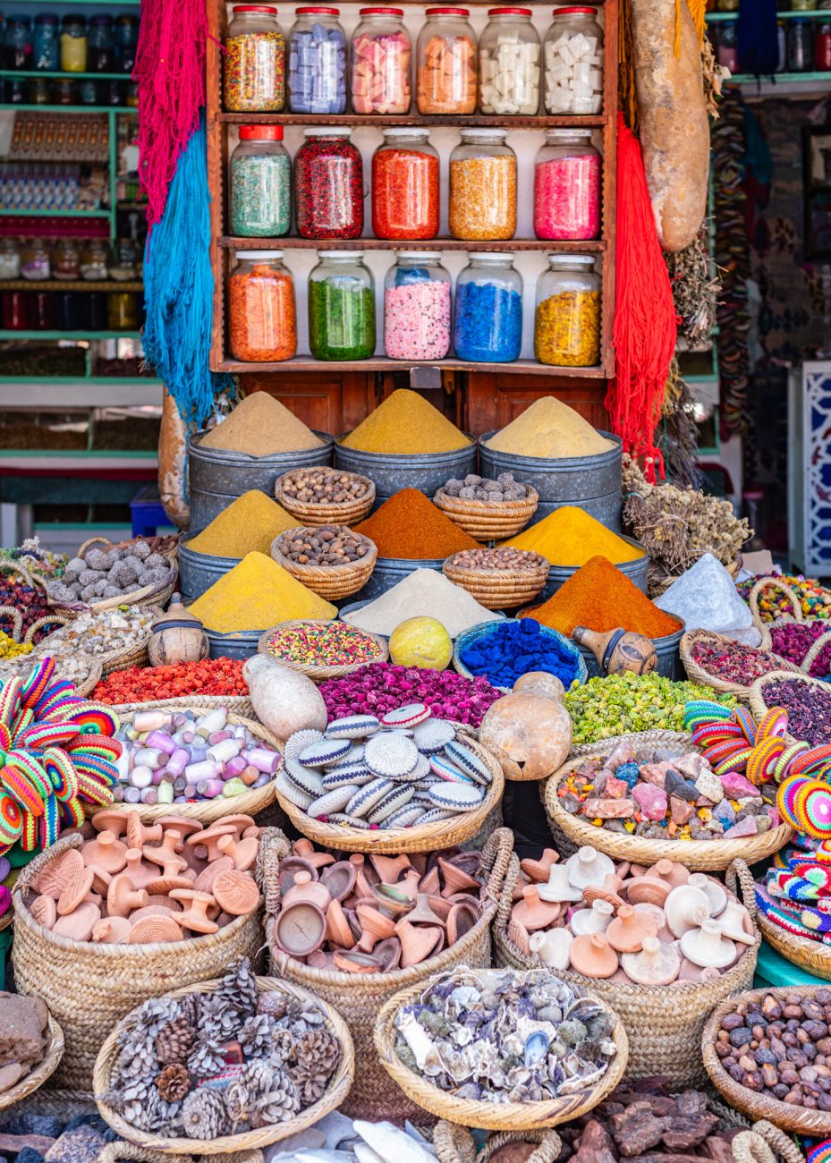 Traditional spice shop inside the Marrakesh Medina souk, with colorful Moroccan spices and herbs