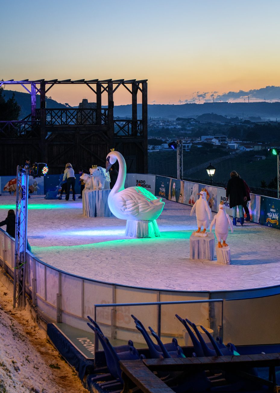 Families skating on the ice rink at Vila Natal Óbidos Christmas festival