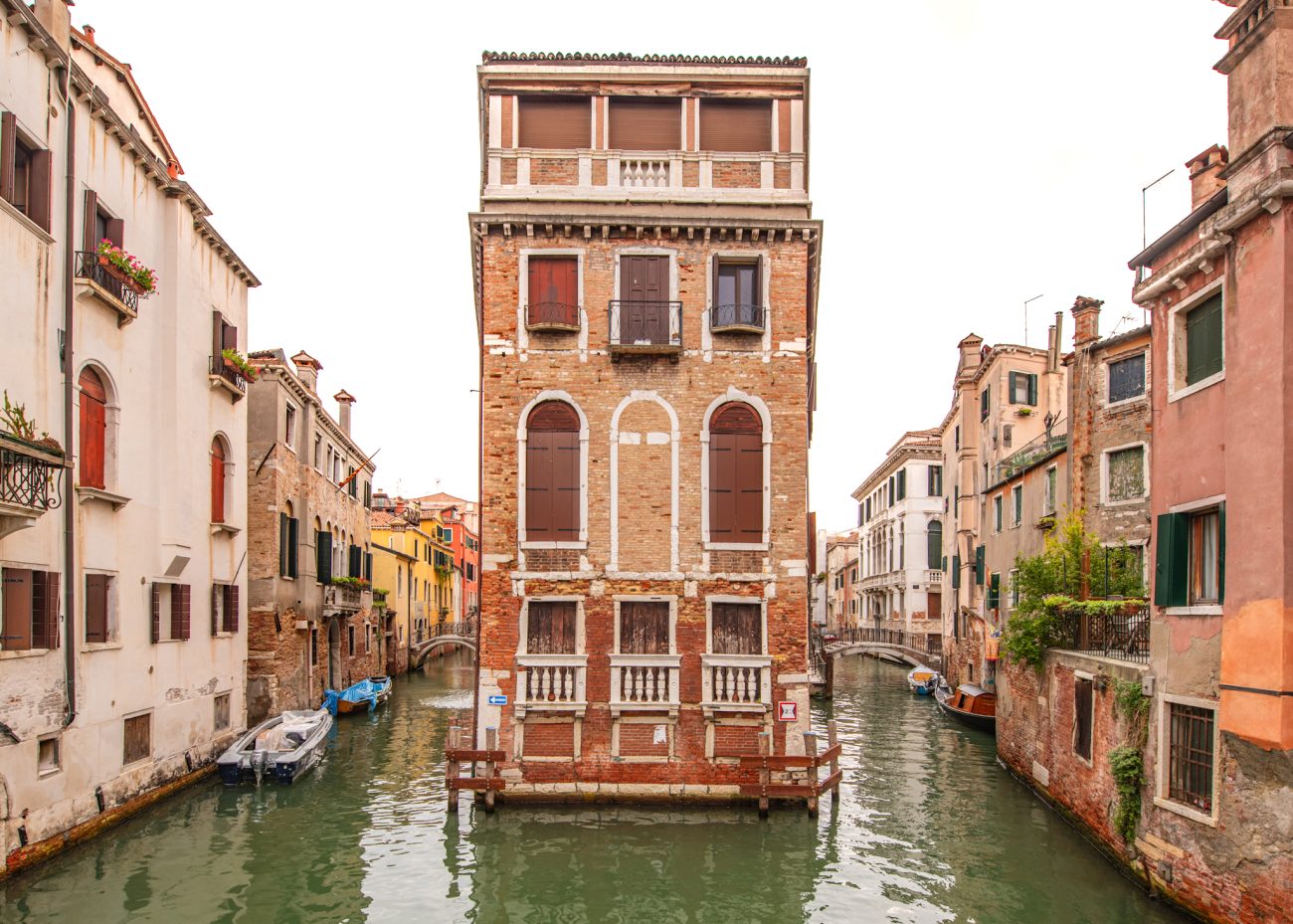 Palazzo Tetta framed by canals making it a hidden photo spot in Venice