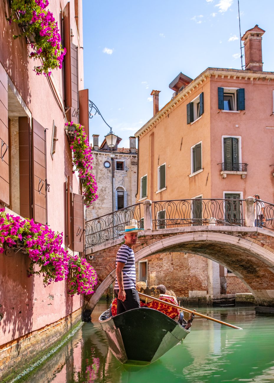 Gondola ride in Venice passing through a narrow canal