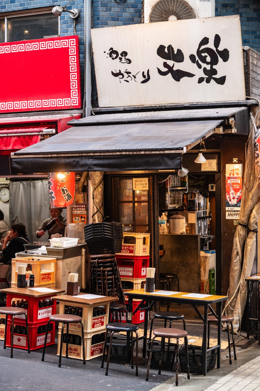 Ameyoko Market in Ueno, Tokyo, a lively shopping street filled with food stalls, restaurants, clothing stores, and local shops