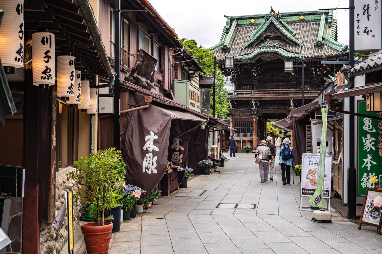 Shibamata Taishakuten Sando in Tokyo, a traditional shopping street lined with local shops, food stalls, and historic storefronts
